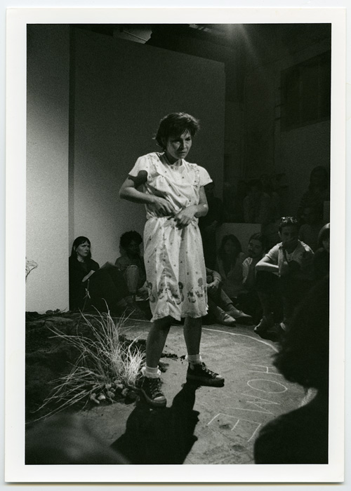 1990_09_10_Performance_Vancouver_Performance_Art_Series_untitled_Margo_Kane_at_grunt_gallery_Kane_standing_HOME_written_on_floor