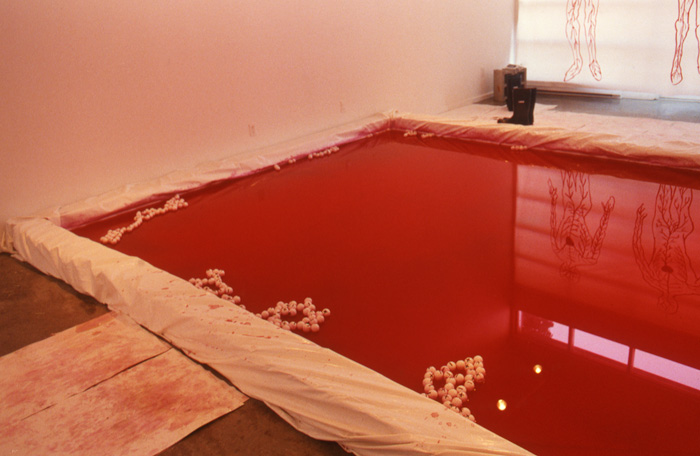 Rubicon_installation_view_blood_pool_rubber_boots